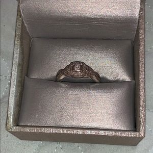 Zale’s 1/4 ct twisted shank promise ring.